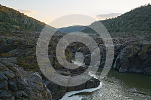 Pulo do Lobo waterfall with river guadiana and rock details at sunset in Mertola Alentejo, Portugal