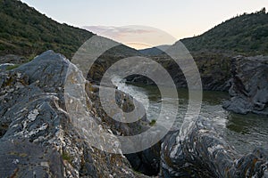 Pulo do Lobo waterfall with river guadiana and rock details at sunset in Mertola Alentejo, Portugal