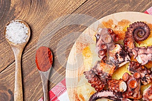 Pulpo a la gallega,galician octopus with ,potatoes paprika, salt and olive oil.  typical Spanish Galician tapa, on a traditional photo