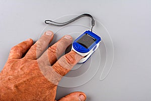 Pulse oximeter on a female hand