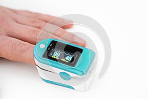 Pulse oximeter, finger digital device to measure oxygen saturation in blood on white