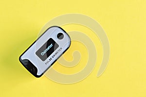 Pulse oximeter isolated on a yellow background