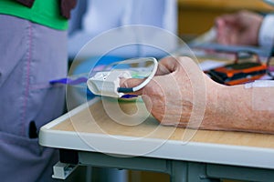 Pulse oximeter on patient's fingertip