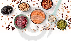 Pulses. Legumes assortment on a white background, shot from the top with a place for text