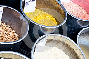 Pulses placed in steel drums with price tags ready for sale