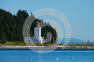 Pulteney Point Lighthouse in the Malcolm Island, British Columbia, Canada photo