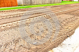 Pulverized Blacktop Pavement With Large Tire Tracks