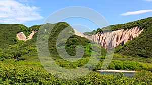 Pumice rock outcrops near river. Kutkhins baht, Kronotsky Reserve, Kamchatka, Russia