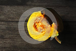 Pumkin yellow and half of ball on wood background