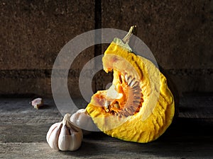 Pumkin yellow and half of ball on wood background