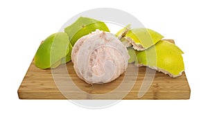 Pummelo and rind on cutting board