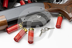 Pump action Shotgun and gun safety trigger locked on white background , Home safety concept