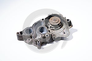 The pump is automobile on a white background. The water pump is dirty.