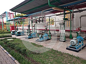pump and electric motor installation in a factory