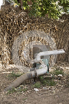 A pump for irrigating the fields with water from the Nile in a Traditional Egyptian village near Cairo