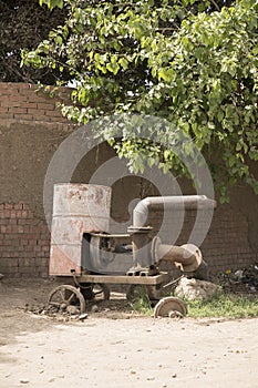 A pump for irrigating the fields with water from the Nile in a Traditional Egyptian village near Cairo