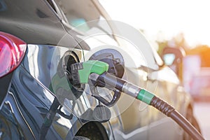 Pump pumps in a gas station. Fuel nozzle to refill fuel in car at gas station