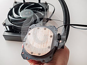 Pump with water block of computer chip water cooling system, heat removal from CPU and video card of high-level system components