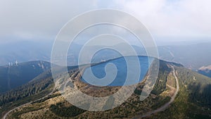 Pumped water storage hydro power plant reservoir aerial drone view