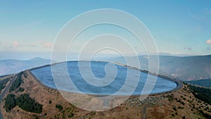 Pumped water storage hydroelectric plant reservoir aerial view