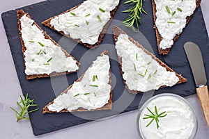 Pumpernickel bread with feta, cream cheese, rosemary, lemon, garlic dip