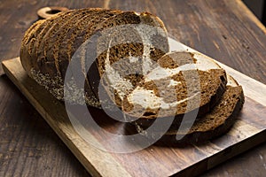 Pumpernickel and rye swirl bread Slices on cutting board