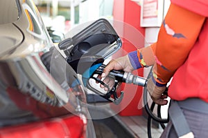 Pumping gas into a car