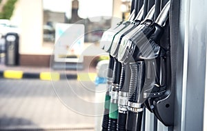 Pumping gas and diesel at pump. Close-up of a fuel pistol for refueling gasoline and diesel.