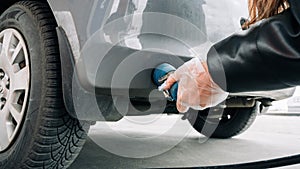 Pumping gas fuel car at oil station. Woman hand refuel petrol nozzle tank. Refueling transportation and Automotive