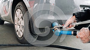 Pumping gas fuel car at oil station. Woman hand refuel petrol nozzle tank. Refueling transportation and Automotive