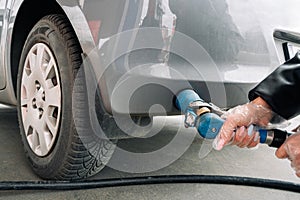 Pumping gas fuel car at oil station. Woman hand refuel petrol nozzle tank. Refueling transportation and Automotive