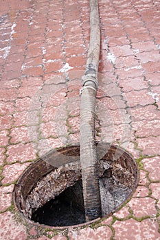 Pumping sewage from the drain hole