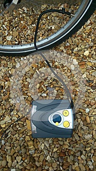 Pumping up bicycle tyre with air compressor