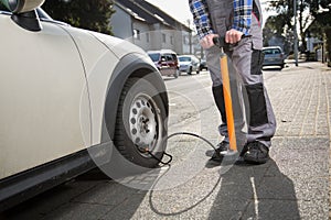 Pumping up a car tire after a malfunction