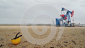 Pumpjack Oil Pump operating on natural gas in the field pumping from the oil well