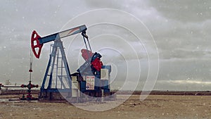 Pumpjack Oil Pump operating on natural gas in the field pumping from the oil well