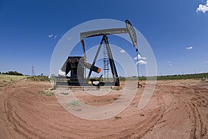 Pumpjack over oil well