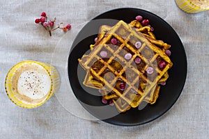 Pumpkin Belgian waffles with honey and viburnum and a pumpkin latte.