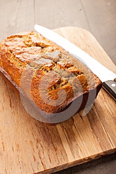 Pumpkin bread on cutting board angled shot