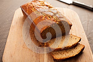 Pumpkin bread on cutting board horizontal shot
