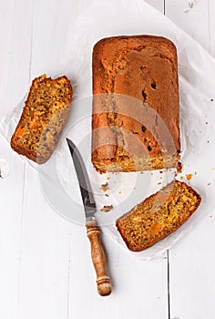 Pumpkin bread loaf over white wooden background