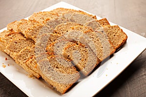 Pumpkin bread on white platter horizontal shot