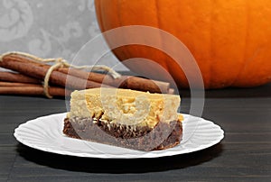 Pumpkin Brownie Cheesecake Bars