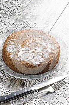 Pumpkin cake on glass plate and lace napking