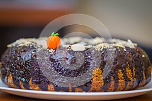 Pumpkin cake kuglof with brown chocolate dressing photo