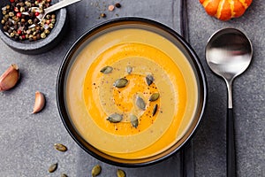 Pumpkin and carrot soup with seeds Top view