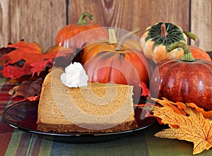 Pumpkin cheesecake in autumn setting