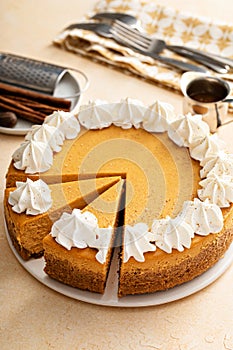 Pumpkin cheesecake with fall spices topped with whipped cream