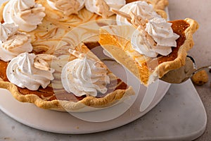 Pumpkin cheesecake swirl pie topped with whipped cream