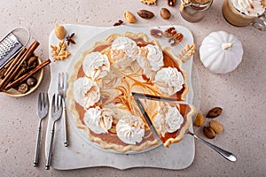 Pumpkin cheesecake swirl pie topped with whipped cream